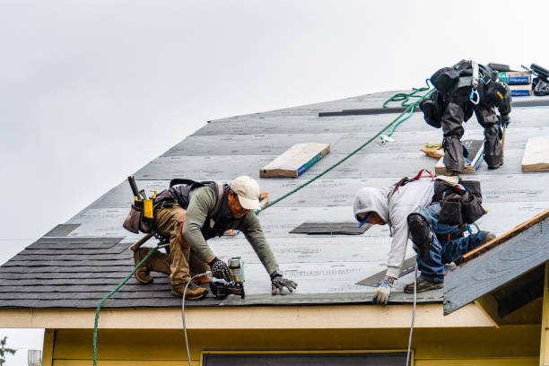 Professional Roofing technician working in East Syracuse, NY